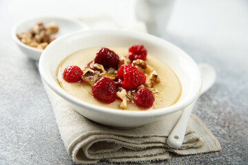 Homemade semolina pudding with raspberry and nuts
