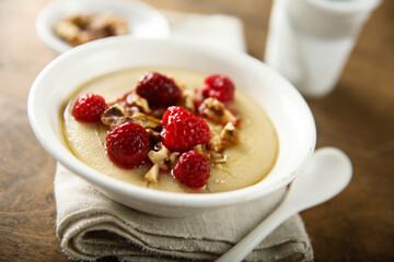 Homemade semolina pudding with raspberry and nuts