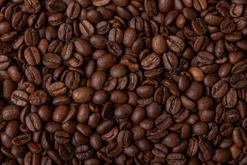 Fototapeta premium dark roasted coffee beans background, arabic roasting coffee