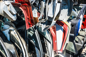 Colorful car doors at scrap yard