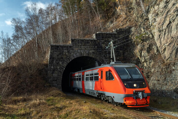 The train leaves the tunnel on the Circum-Baikal Railway