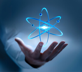 Business man hand showing symbol of an atom nucleus with electrons - 3D illustration	

 - obrazy, fototapety, plakaty