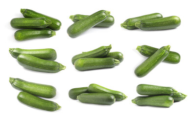 Set of fresh ripe zucchinis on white background