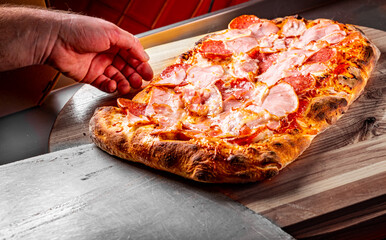 flatbread Pepperoni roman Pizza with Mozzarella cheese, salami, ham, Tomato sauce, pepper, Spices....