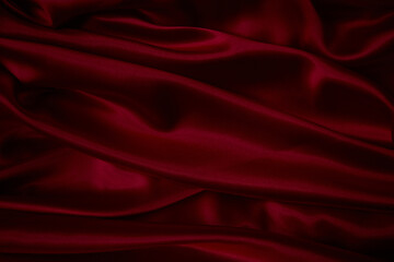 Fototapeta na wymiar Beautiful draped silk fabric in red.