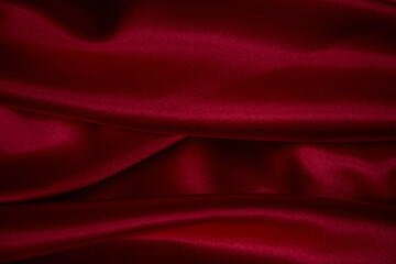 Obraz na płótnie Canvas Beautiful draped silk fabric in red.