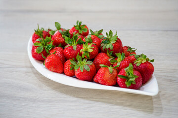 a plate full of fresh fruit strwberry