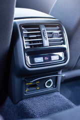 Climate control unit for rear passengers in a car with a 220 volt socket