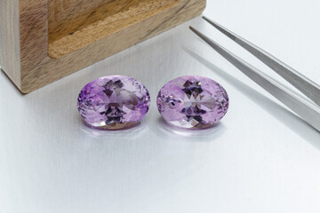 macro mineral faceted stone cut Amethysts on a gray background