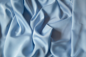 Beautiful draped silk fabric in blue.