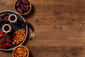 Islamic rosary with dates fruits and tea. Ramadan Kareem concept
