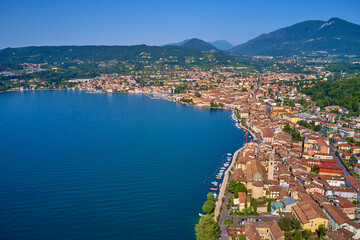 Panoramic view of the historic part of Salò on Lake Garda Italy. Tourist site on Lake Garda. Lake in the mountains of Italy. Aerial view of the town on Lake Garda.