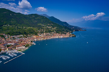 Fototapeta na wymiar Aerial view of the town on Lake Garda. Panoramic view of the historic part of Salò on Lake Garda Italy. Tourist site on Lake Garda. Lake in the mountains of Italy.