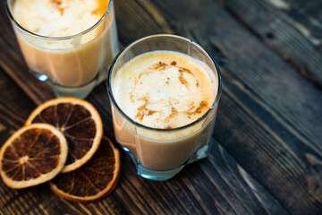 Yellow Indian mango yoghurt drink Mango Lassi or smoothie with turmeric and saffron.