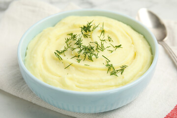 Freshly cooked homemade mashed potatoes on white table, closeup