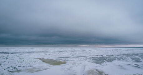 Obraz premium Frozen Baltic sea during cloudy winter day in Latvia.