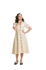 Young beautiful girl in retro style dress, fashion of 70s, 80s years posing isolated on white studio background with copyspace for ad.