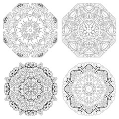 Hand drawn zentangle set of 4 mandalas for coloring page.