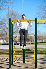 young boy exercising in a park