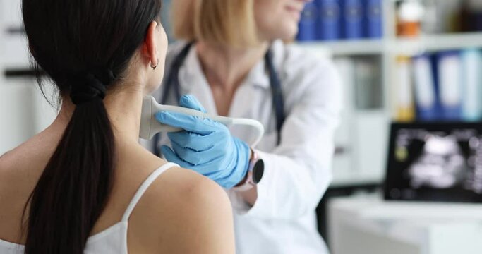 Doctor measures patient thyroid gland closeup