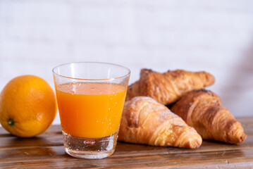 Breakfast with coffee, orange juice, croissant