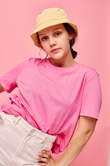 portrait of a young woman fashion clothes hat pink t-shirt decoration posing