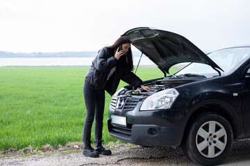 young woman driver have mechanic problem on the road