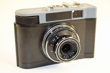 vintage photo camera film close-up on a white background isolated