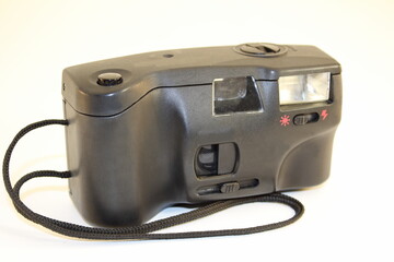old film camera close-up on a white background isolate