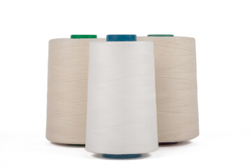 Spool of sewing thread, isolated on white background. Colored yarns used by factories in the clothing industry. Threads wound on the spool. Colored reels