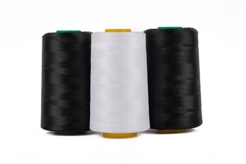 Spool of sewing thread, isolated on white background. Colored yarns used by factories in the clothing industry. Threads wound on the spool. Colored reels
