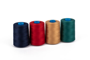 Spool of sewing thread, isolated on white background. Colored yarns used by factories in the clothing industry. Threads wound on the spool. Colored reels