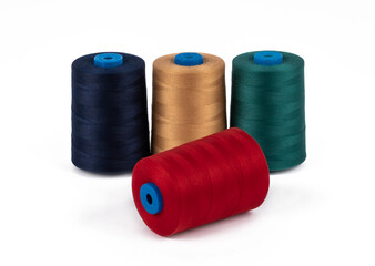 Spool of sewing thread, isolated on white background. Colored yarns used by factories in the clothing industry. Threads wound on the spool. Colored reels