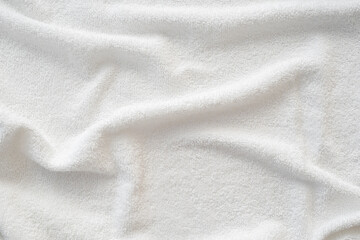 Terry towel texture, top view of a white bath towel