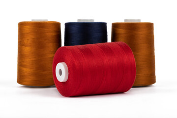 Spool of sewing thread, isolated on white background. Colored yarns used by factories in the clothing industry. Threads wound on the spool. Colored reels