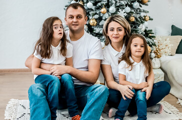 Happy family and New Year's fairy tale. Girl with down syndrome