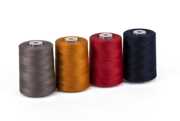 Spool of sewing thread, isolated on white background. Colored yarns used by factories in the clothing industry. Threads wound on the spool. Colored reels