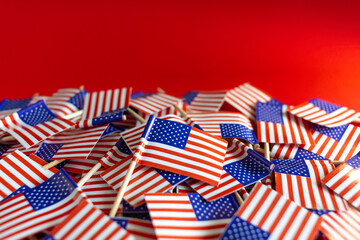 American flags flat lay on the red background. Happy Independence day USA.