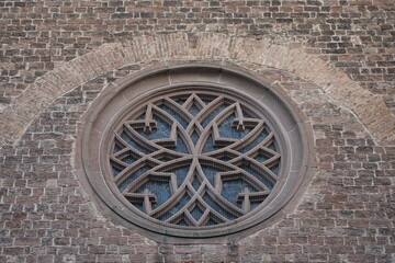 Close up of rose window of Maria Schutz catholic church, concept of religion, Christ, holiness, resurrection and worship (horizontal), Kaiserslautern, Rhineland Palatinate, Germany