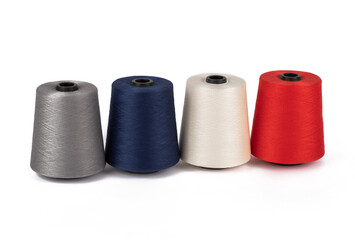 Spool of sewing thread, isolated on white background. Colored yarns used by factories in the clothing industry. Threads wound on the spool. Colored reels
