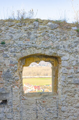 window in the wall of old castle 