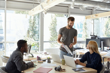 Multiracial business team working at sunny office