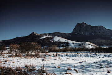 Fototapeta na wymiar Clear blue sky hiking day. Winter landscape in Apuseni Mountains, Romania