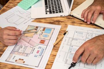 two colleagues interior designers discussing about color for renovation on house plan
