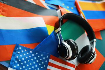 Headphones and flag. The study of foreign subjects. Audiobooks in a foreign language. Language...