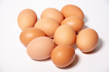 ten chicken eggs in the center on a white background