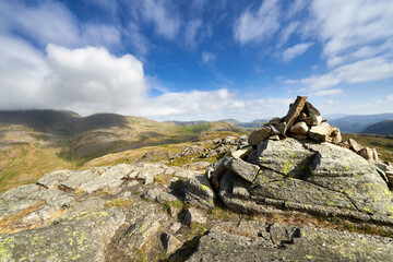 Vews of Great Gable and Green Gable from the mountain summit cairn of Seathwaite Fell in the English Lake District.