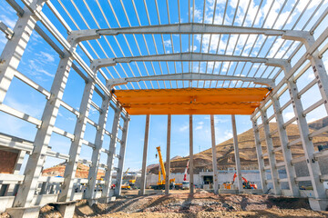 Interior view of the walls, supports, and roof of a precast commercial industrial prefabricated...