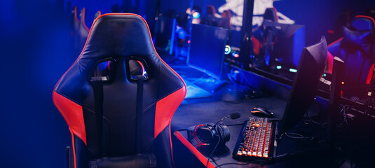 Banner Professional gamers cafe room with powerful personal computer game chair blue color. Concept...