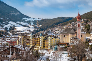 Fototapeta na wymiar Landscape of Ortisei, Italian village in Dolomites Alps. 